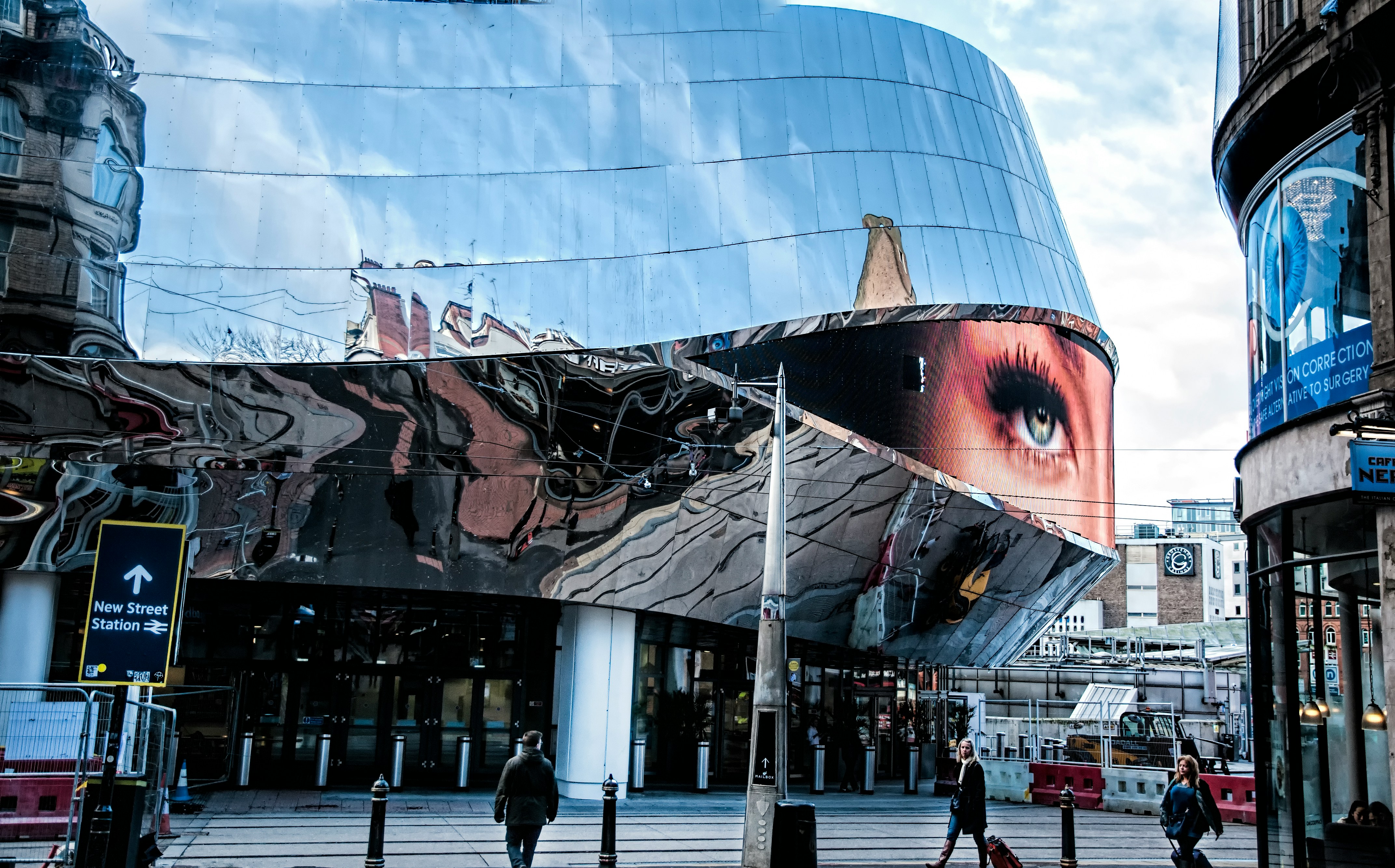 people-walking-near-glass-building-during-daytime