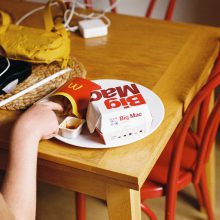 fast food on table with hand reaching for