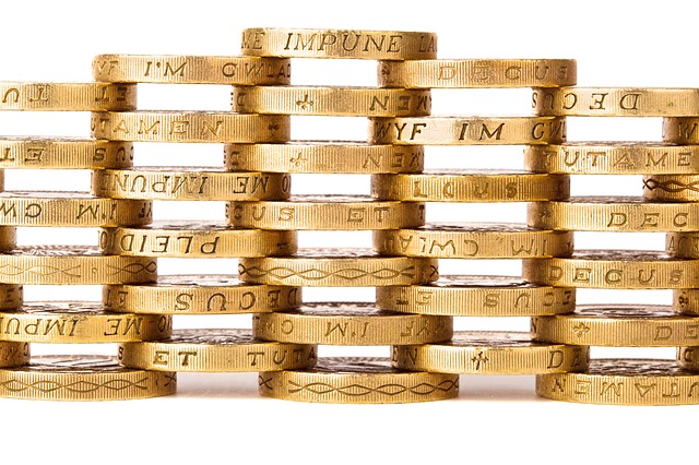 Pound coins stacked into a lattice wall