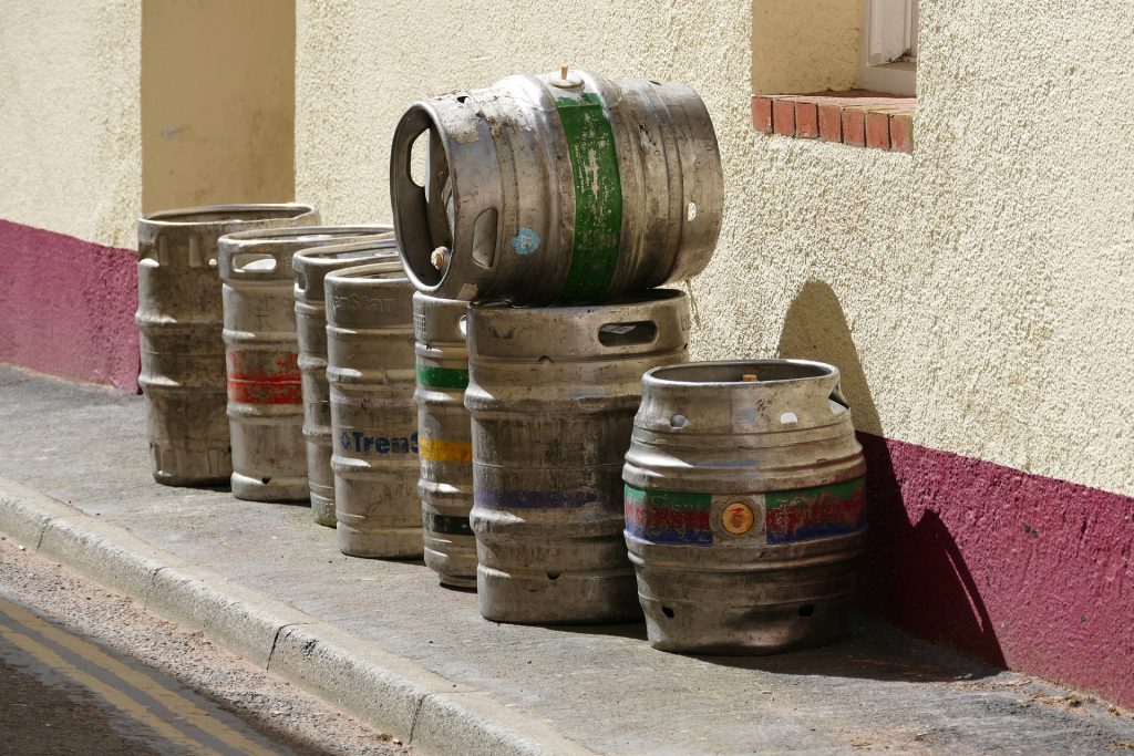 Empty beer kegs stacked outside