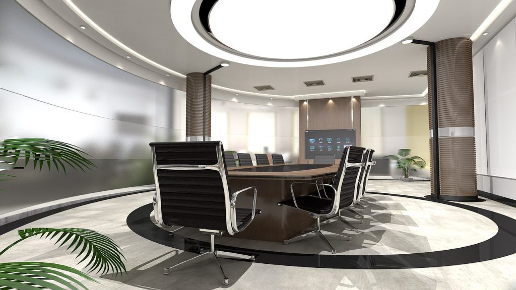 A fancy modern office, what with the plants and the lights and the leather chairs
