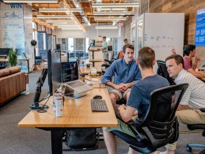 men at office desk 