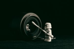 lego stormtrooper in front of a camera lens 