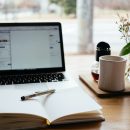 laptop, book and mug