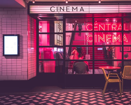 A cinema with a neon lit window