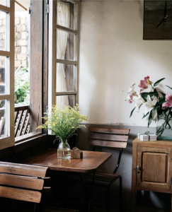 wooden desk by window 