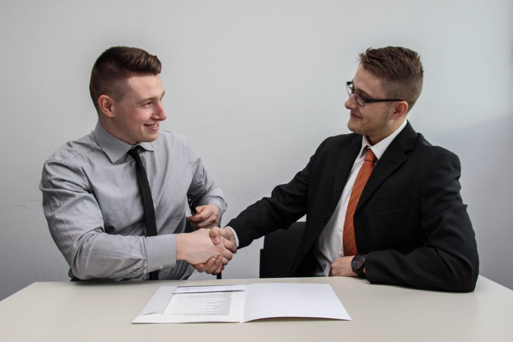 two men shaking hands 