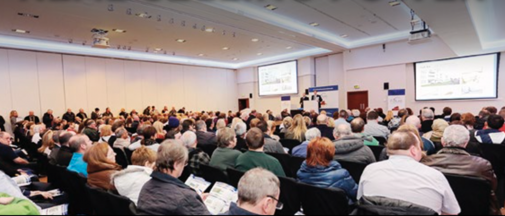 view of people seated in an auction room