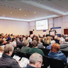 view of people seated in an auction room