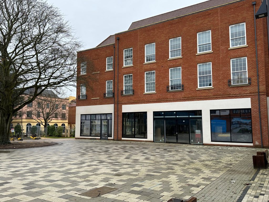 shop front exterior with square area in front 