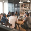 people sat round an office table