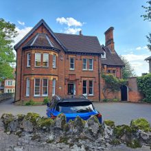 large house with drive in front