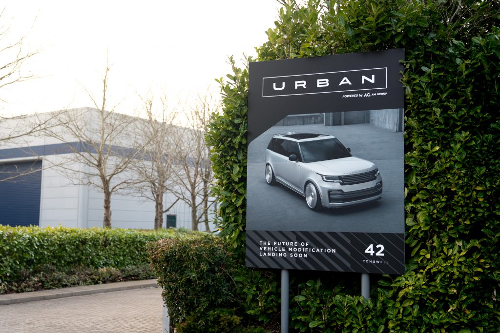 car sign in front of warehouse 