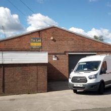 van in front of warehouse