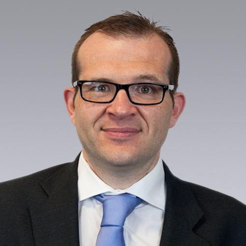 head and shoulders shot of man in a suit