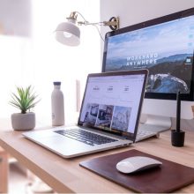a laptop and monitor set out on a desk