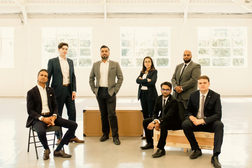 a group of busness men and women in an office 
