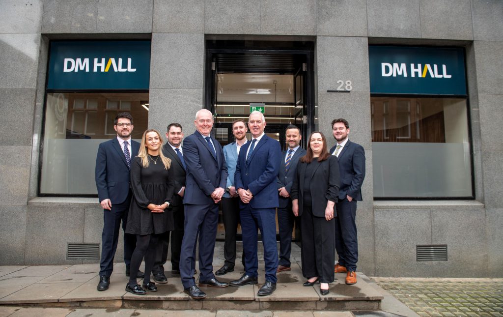 group of business people outside an office building