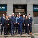 group of business people outside an office building