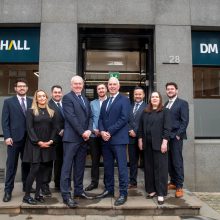 group of business people outside an office building