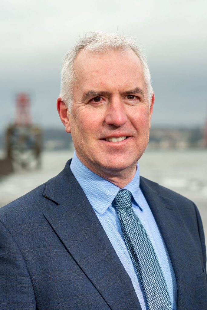 head and shoulders photo of a man in a business suit