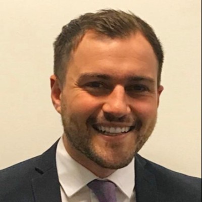 head and shoulders photo of man in business suit