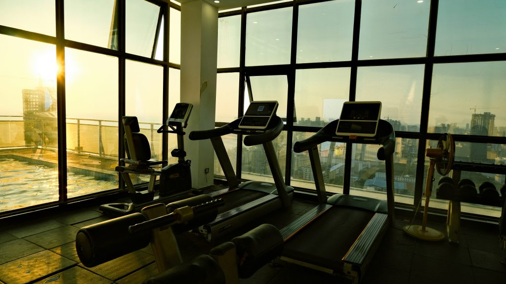 running machines in a gym at evening