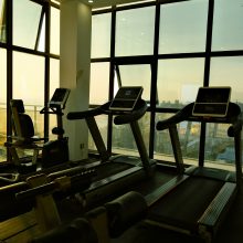 running machines in a gym at evening