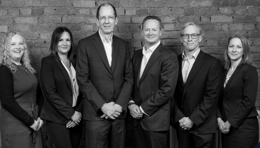 group of business men and women black and white photo