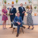 group of people - 4 standing 1 sitting