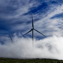 Wind turbine surrounded by clouds