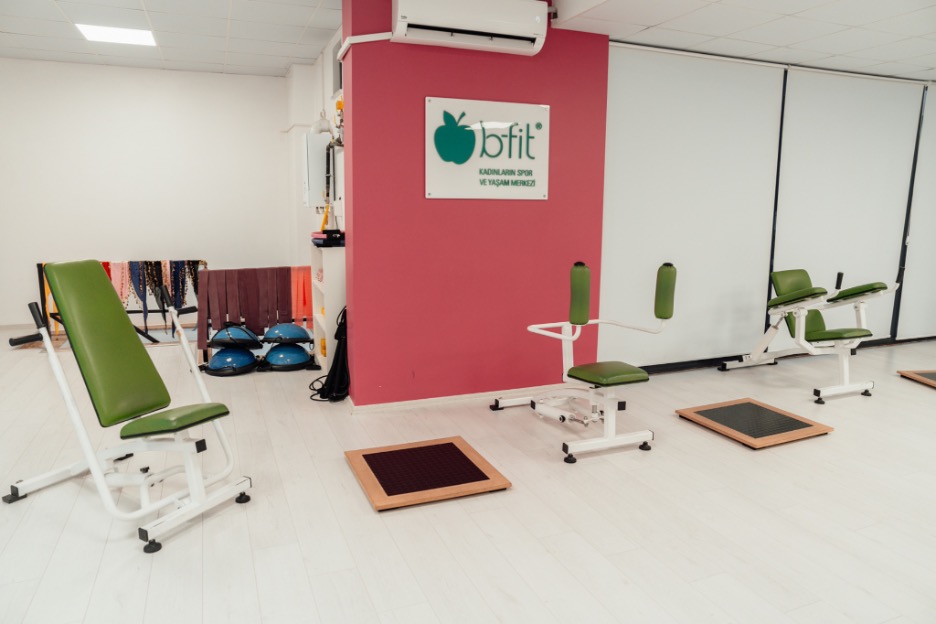 Gym equipment in a white room