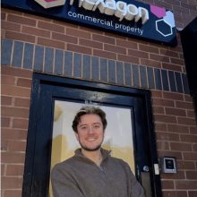 man standing in front of an office