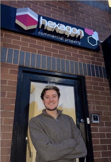 man standing in front of an office