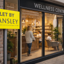 a let by sign on the front of a wellness centre retail unit