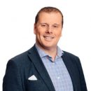 head and shoulders portrait shot of man in suit