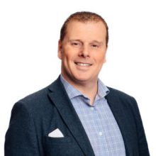 head and shoulders portrait shot of man in suit