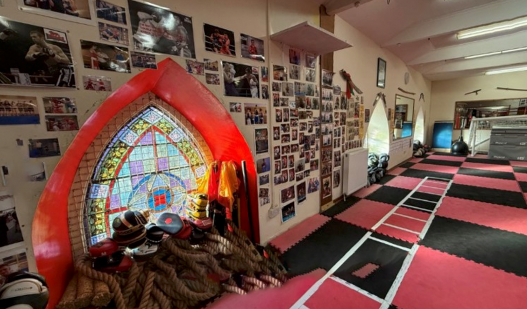 commercial studio with arched stained glass window