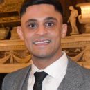 head and shoulders of man in business suit and tie