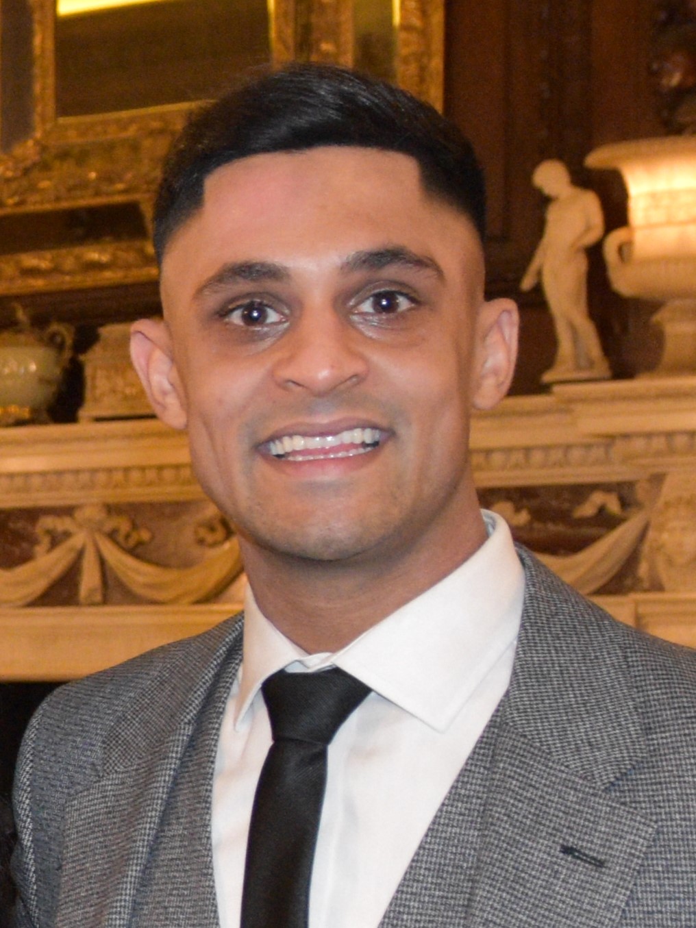 head and shoulders of man in business suit and tie